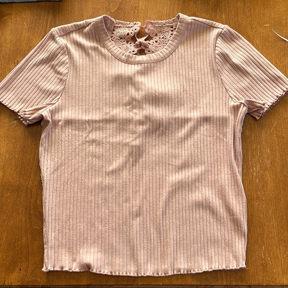 Juniors knit top. Lacey tie back.